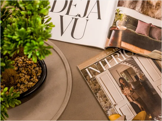 Modern Luxury Interiors magazine photographed on a table