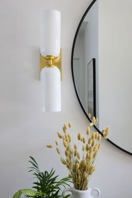 Wall lighting and curved mirror detailing