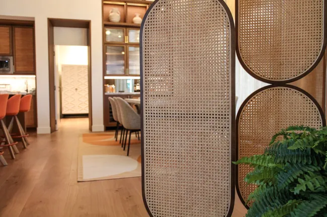 Open-plan interior with a crafted room divider