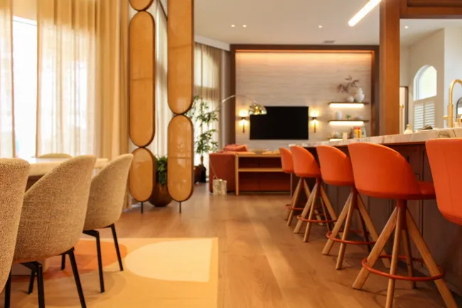 Living and dining space with warm millwork