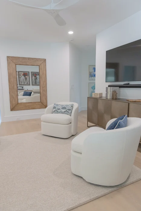 Sitting room with cream seating and blue accents