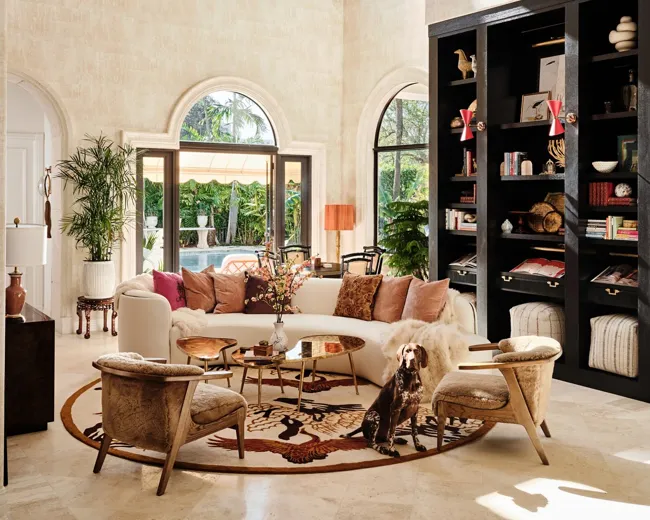 Living room with built-in shelving and layered finishes
